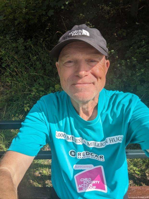 Alan wearing his walk T-shirt and baseball cap