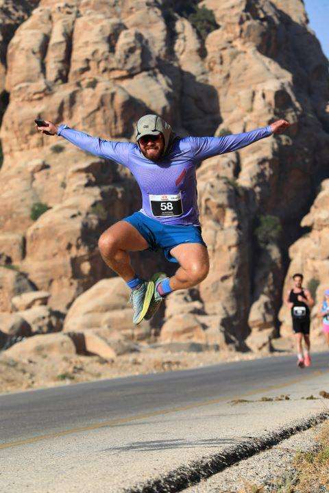 Ed pictured jumping during desert marathon 