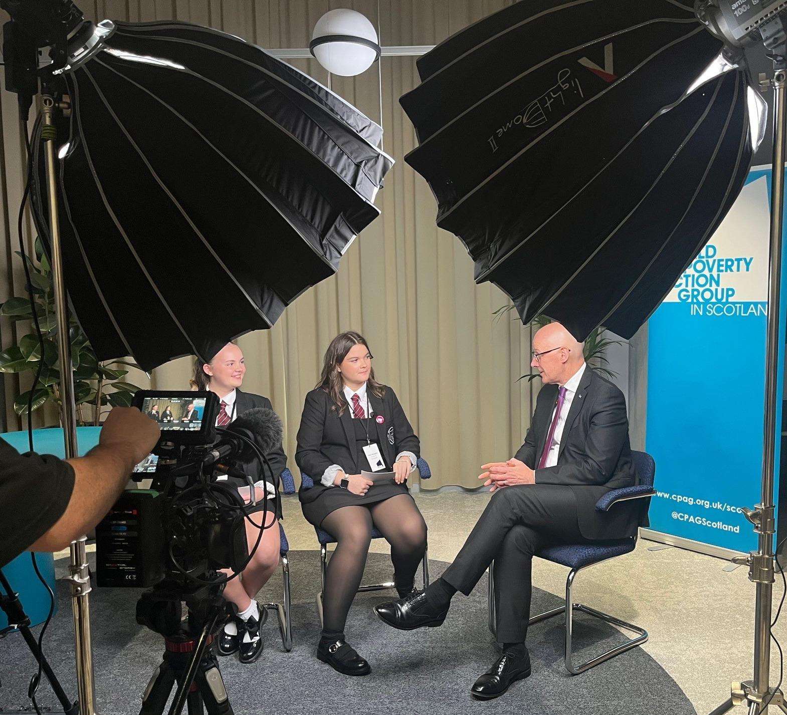 First Minister of Scotland being interviewed by two pupils