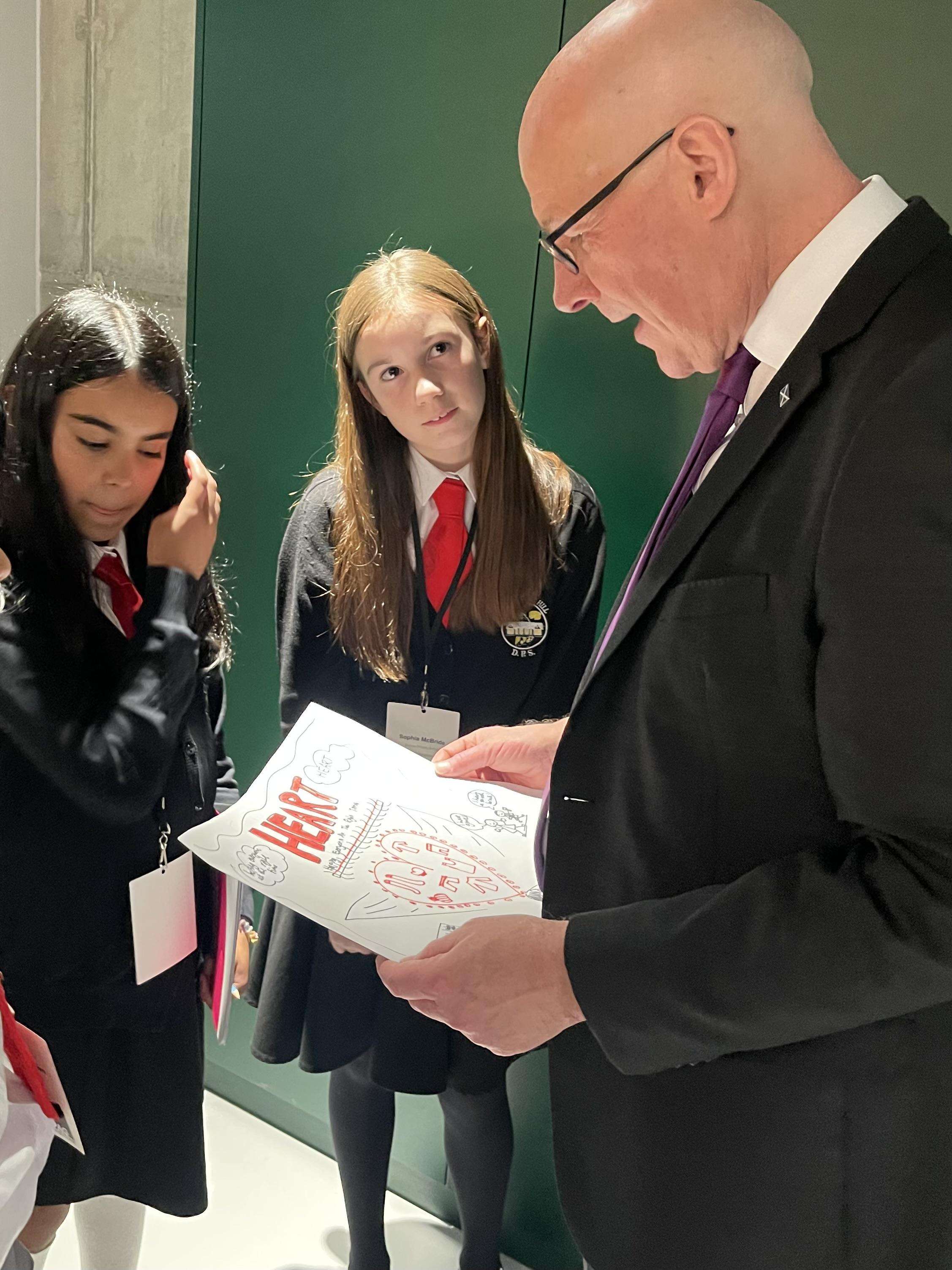 Scotland's First Minister speaking to children from Dunlop Primary School