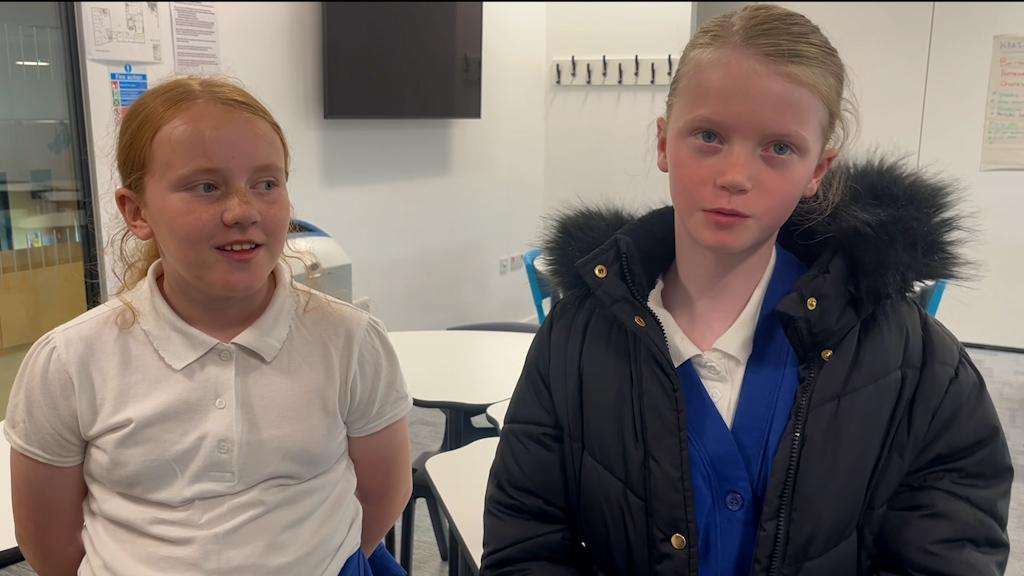 Two girls at West Lothian event sharing their ideas 